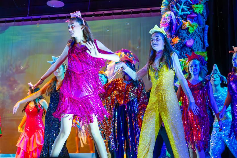 Students perform onstage